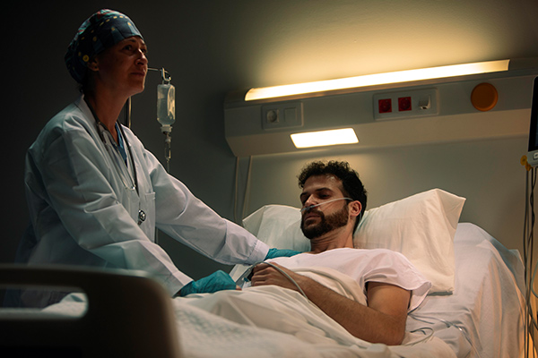 Nurse taking care of patient in the ICU