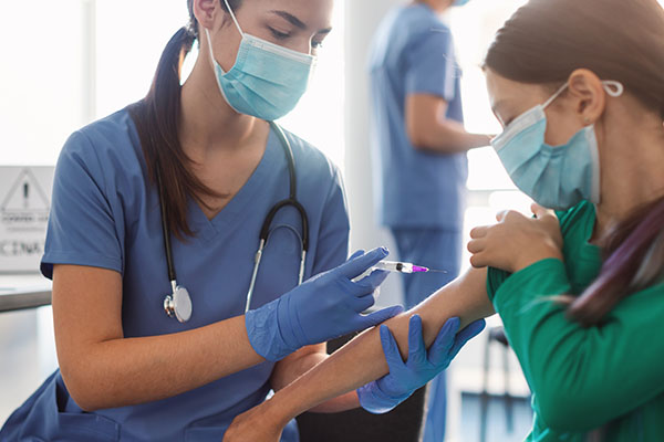 A nurse giving a patient a shot