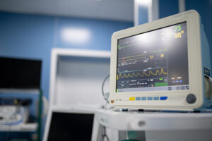 a close up of a vitals monitor in a hospital room