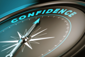 the word "confidence" with a compass pointing towards it