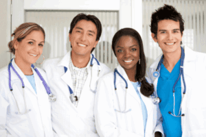 A group of Advanced Practice Registered Nurses smiling and looking at the camera.