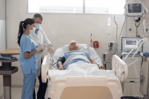 Medical professionals taking care of a patient with cardiogenic shock in the hospital